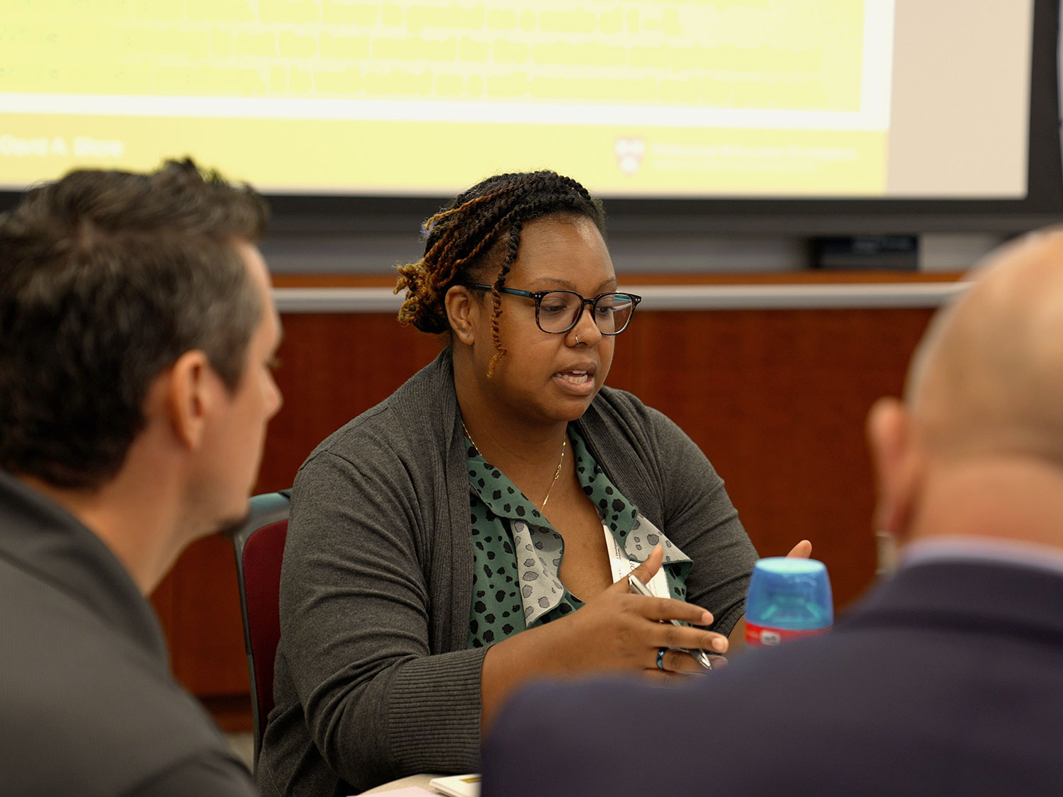 Participants sit in a group and talk.