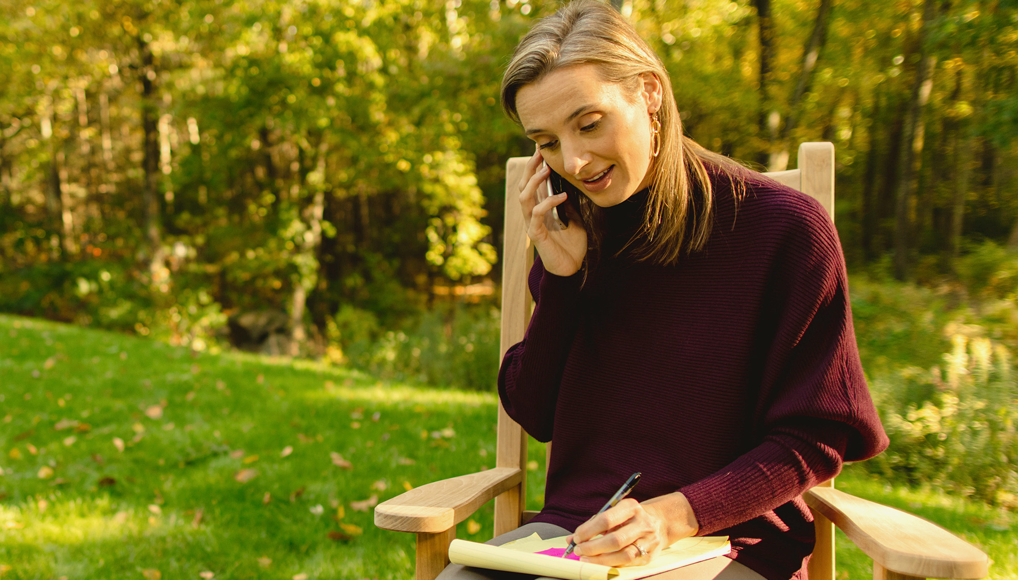 Gender equity. Female professional talking on phone outside.