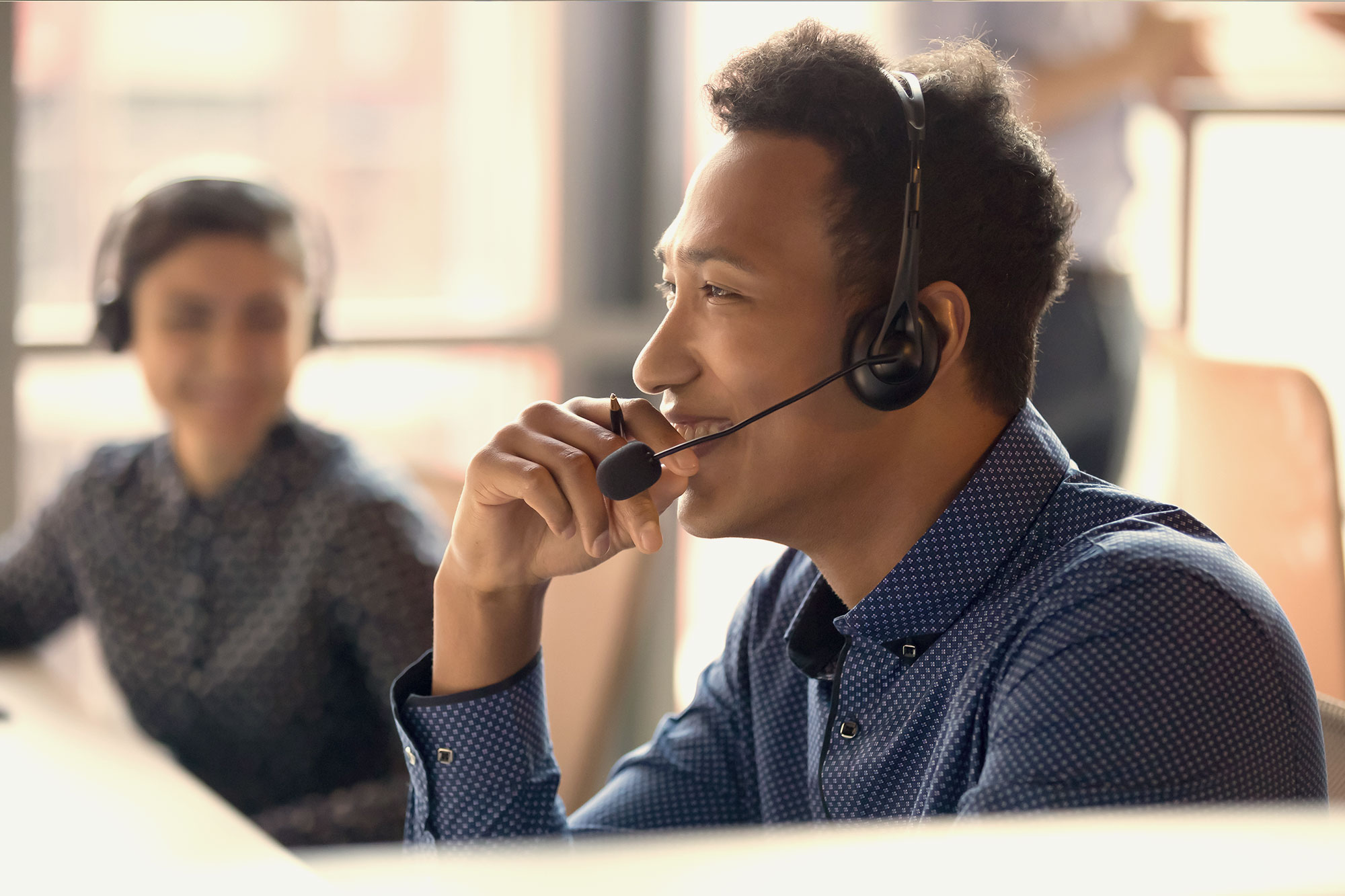 Customer service representative with headset.