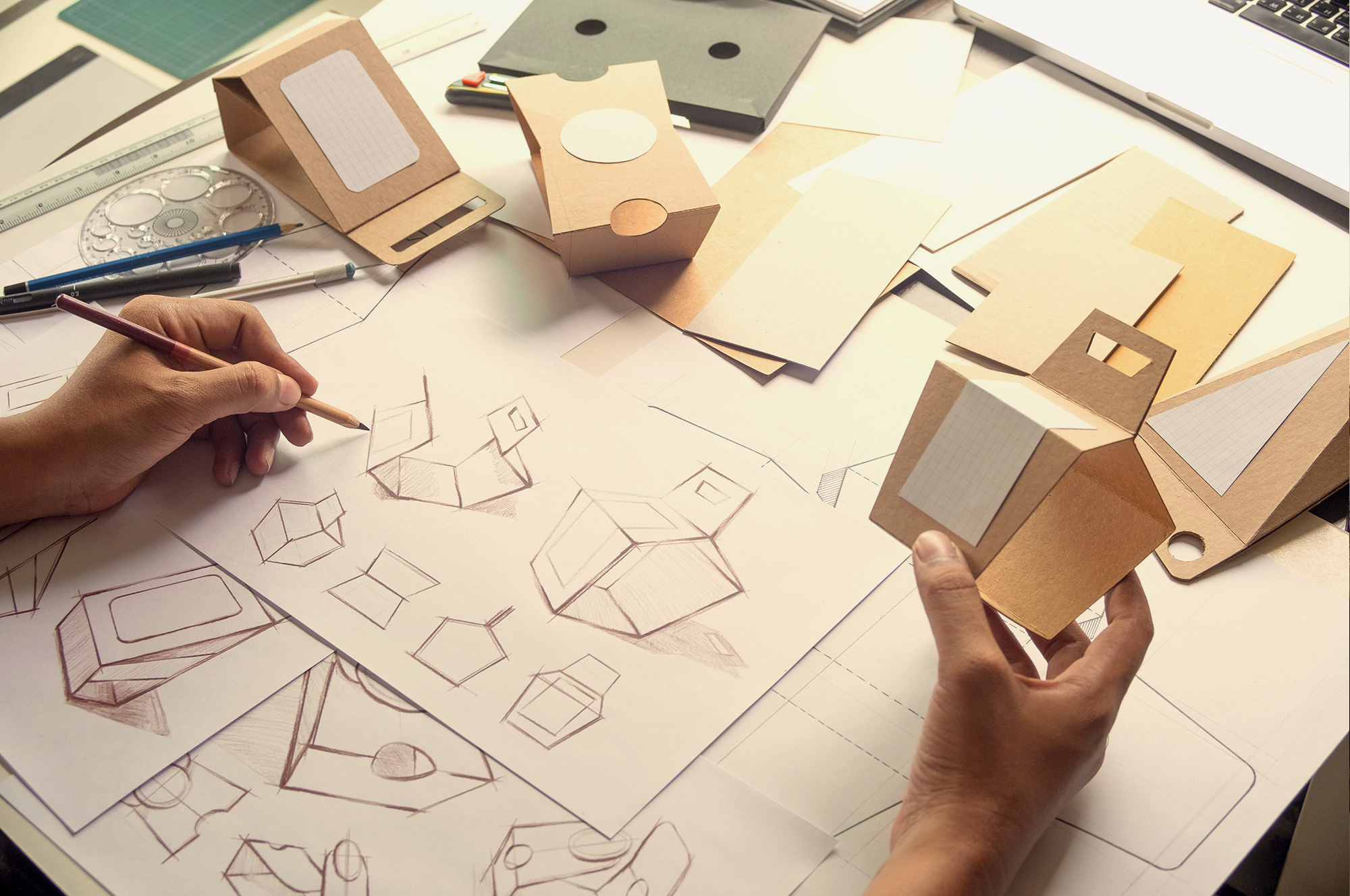 person holding product and making sketches