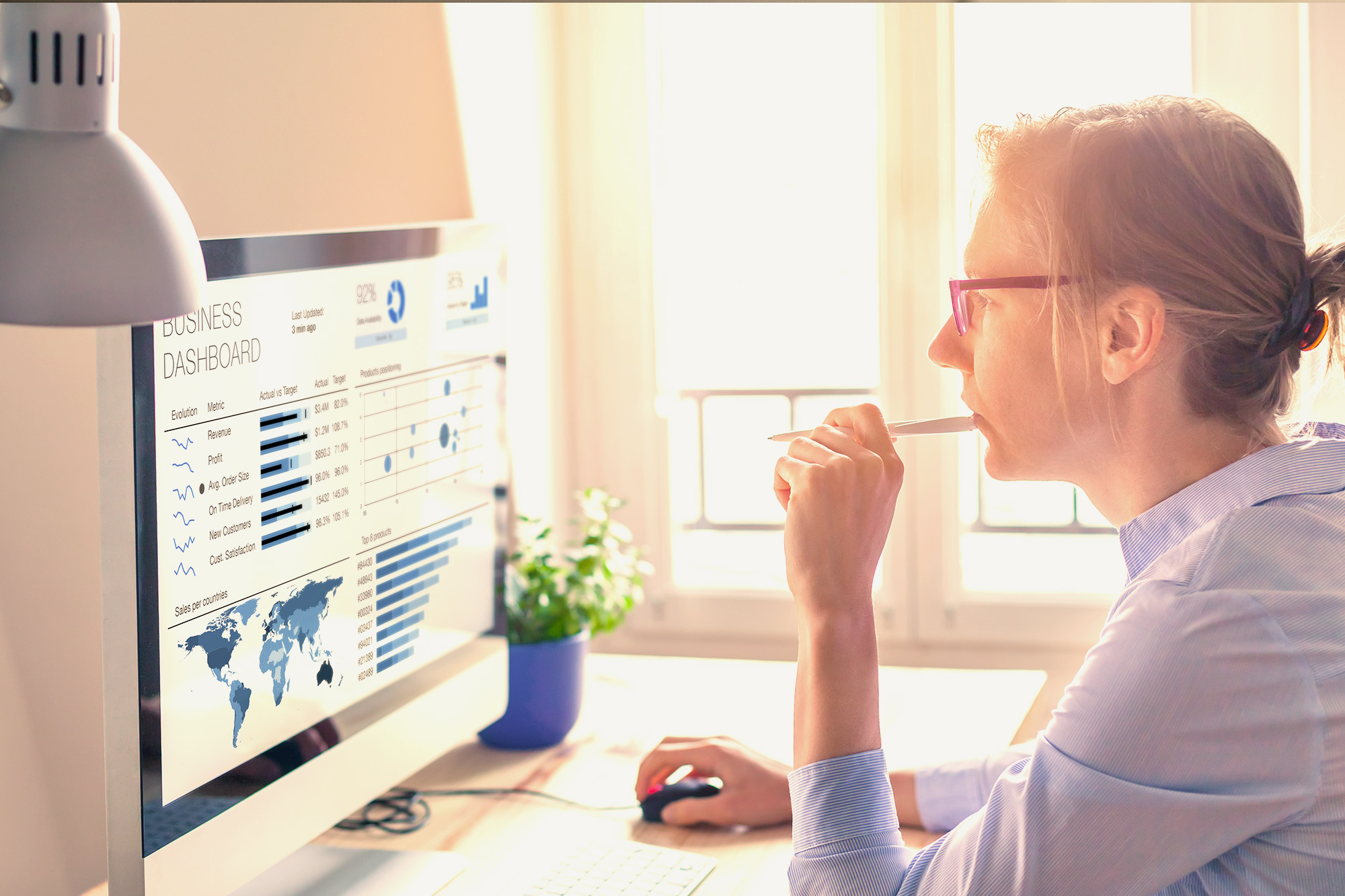 public relations professional looking at data analytics on laptop